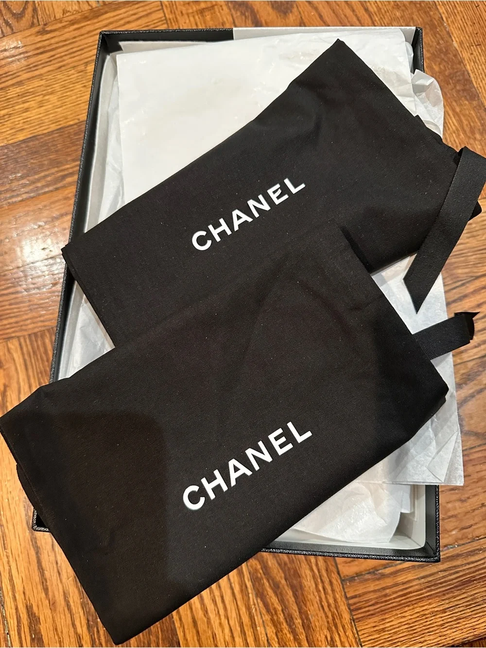 CHANEL Black Leather Logo Thong Sandals with Gold Accent